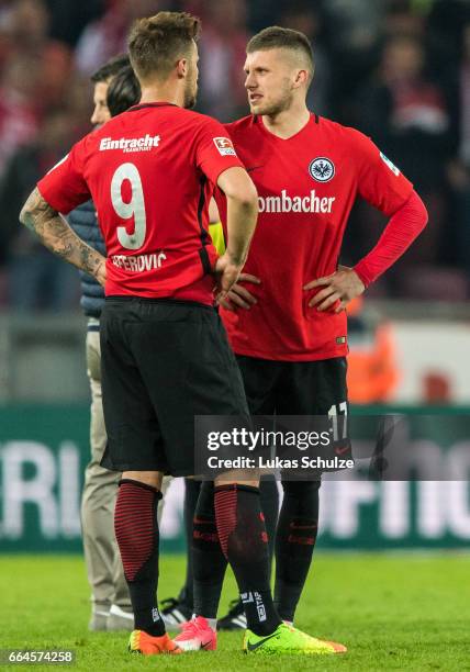 Haris Seferovic and Ante Rebic of Frankfurt react after loosing the Bundesliga match between 1. FC Koeln and Eintracht Frankfurt at...