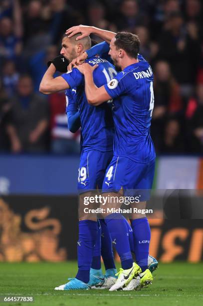 Islam Slimani of Leicester City celebrates scoring his sides first goal with Danny Drinkwater of Leicester City during the Premier League match...