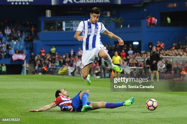 Yuri, #19 of Real Sociedad and Juanfran, #20 of Atletico de Madrid during The La Liga match between Club Atletico de Madrid v Real Sociedad de Futbol...