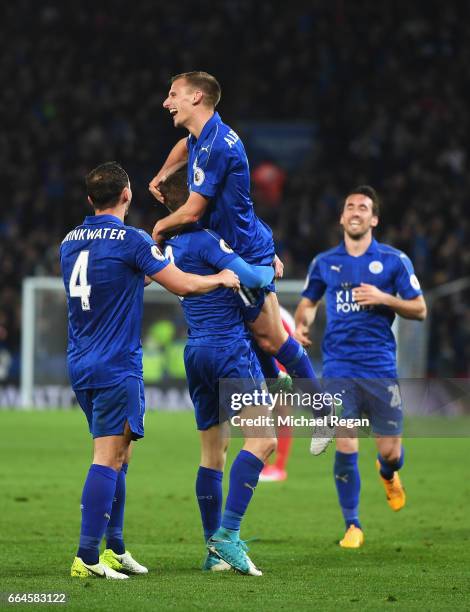 Jamie Vardy of Leicester City celebrates scoring his sides second goal with Marc Albrighton of Leicester City during the Premier League match between...