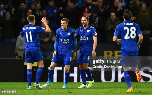 Jamie Vardy of Leicester City celebrates scoring his sides second goal with his Leicester City team mates during the Premier League match between...