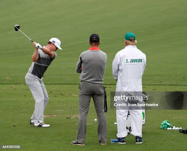 Golfer Zach Johnson hits balls on the practice range during the first day of practice for the 2017 Masters Tournament on April 3 at Augusta National...