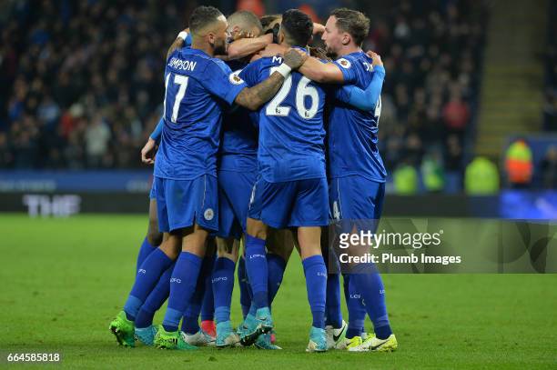 Leicester City players surround Jamie Vardy of Leicester City celebrates after he scores to make it 2-0 during the Premier League match between...