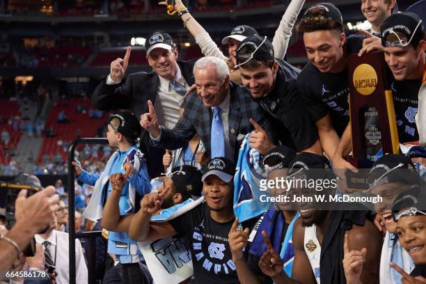 Finals: North Carolina coach Roy Williams victorious with players after winning game vs Gonzaga at University of Phoenix Stadium. Glendale, AZ...