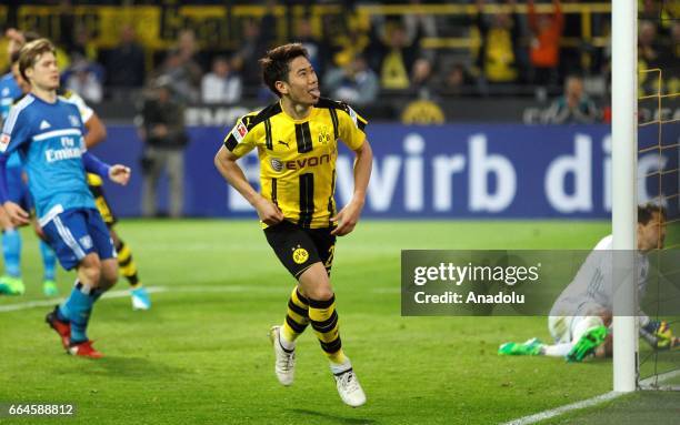 Shinji Kagawa of Dortmund celebrates the 2-0 against Hamburg during the Bundesliga soccer match between Borussia Dortmund and Hamburger SV at the...