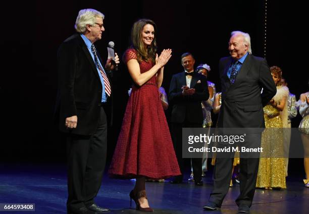 Catherine, Duchess of Cambridge and producers Michael Linnet and Michael Grade speak during the Opening Night Royal Gala performance of "42nd Street"...