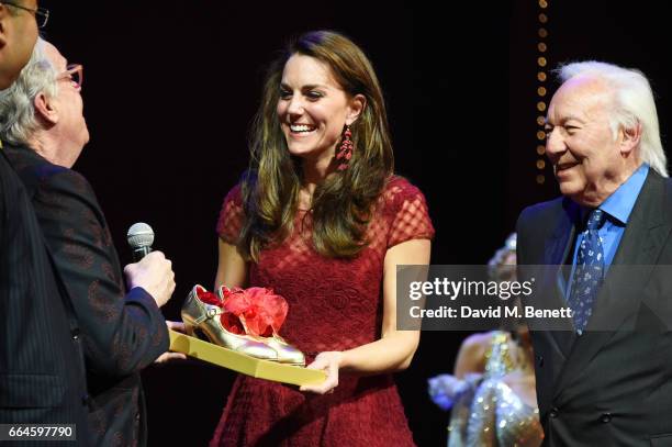 Producers Michael Grade and Michael Linnet present Catherine, Duchess of Cambridge, with tap shoes during the Opening Night Royal Gala performance of...