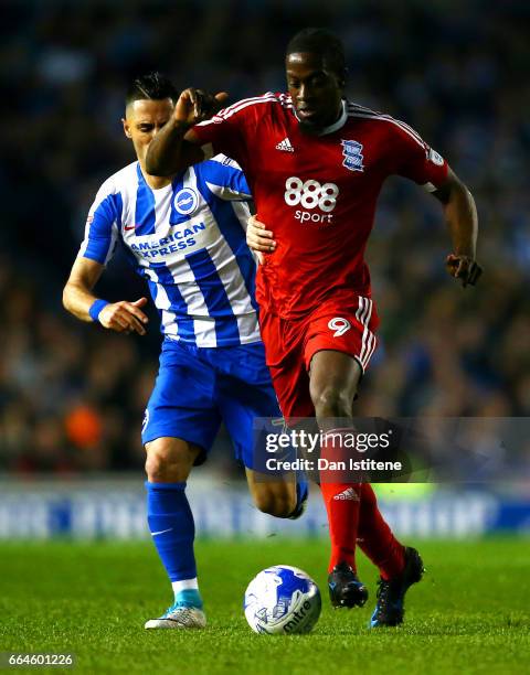 Clayton Donaldson of Birmingham City battles for the ball with Beram Kayal of Brighton & Hove Albion during the Sky Bet Championship match between...