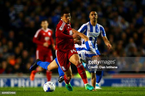 Che Adams of Birmingham City battles for the ball with Uwe Hunemeier of Brighton & Hove Albion during the Sky Bet Championship match between Brighton...