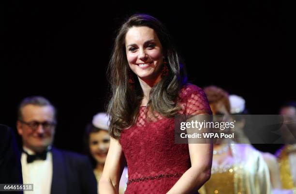 Catherine, Duchess of Cambridge, takes part in a presentation during the Opening Night Royal Gala performance of "42nd Street" in aid of the East...