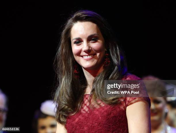 Catherine, Duchess of Cambridge, takes part in a presentation during the Opening Night Royal Gala performance of "42nd Street" in aid of the East...