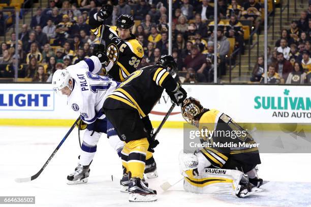 Tuukka Rask of the Boston Bruins saves a shot from Ondrej Palat of the Tampa Bay Lightning during the second period at TD Garden on April 4, 2017 in...