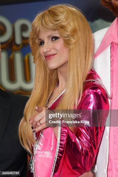 Michelle Hunziker, dressed as a member of the Swedish band ABBA, during the photo call for TV Show 'Top, die Wette gilt! 75 Jahre Frank Elstner' in...