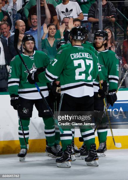 Jason Dickinson, Adam Cracknell, Stephen Johns and the Dallas Stars celebrate a goal against the Arizona Coyotes at the American Airlines Center on...