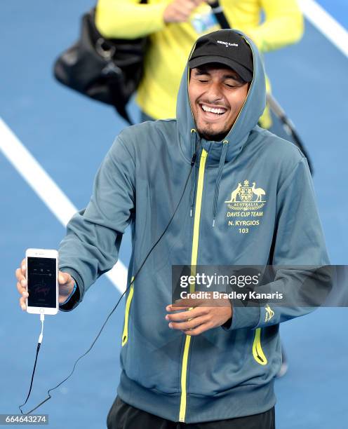 Nick Kyrgios of Australia shares a laugh with team mates during practice ahead of the Davis Cup World Group Quarterfinal match between Australia and...