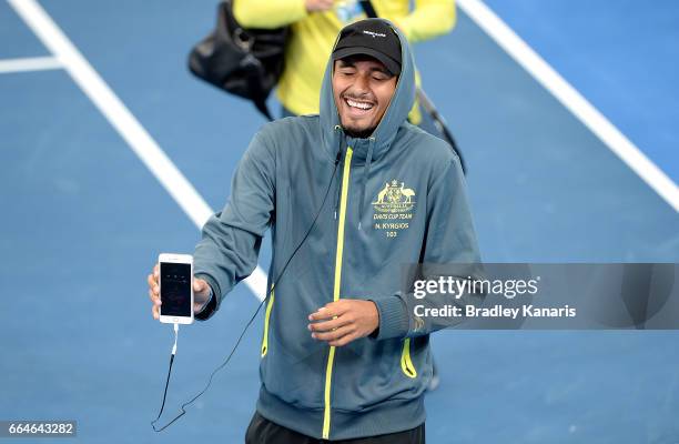 Nick Kyrgios of Australia shares a laugh with team mates during practice ahead of the Davis Cup World Group Quarterfinal match between Australia and...