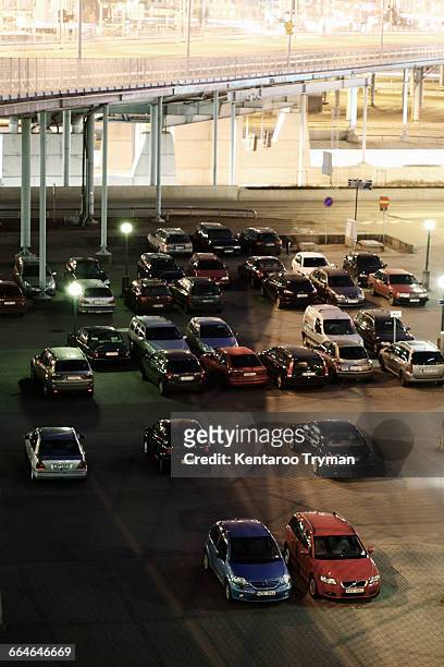 high angle view of cars in parking lot - immobile stockfoto's en -beelden