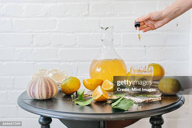a jug of orange juice and fresh fruit. - pipette stock pictures, royalty-free photos & images