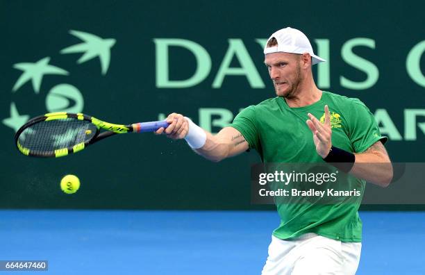 Sam Groth of Australia plays a forehand during practice ahead of the Davis Cup World Group Quarterfinal match between Australia and the USA at Pat...