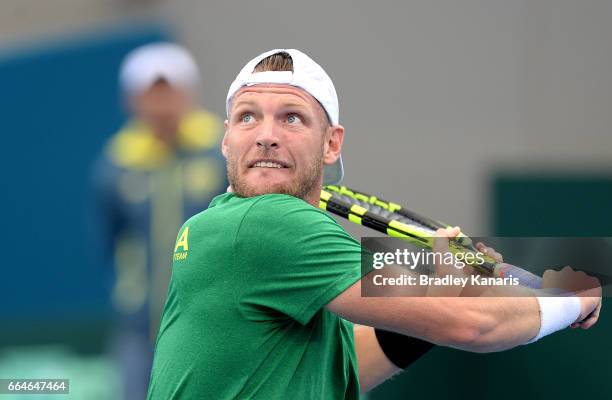 Sam Groth of Australia lines up a shot during practice ahead of the Davis Cup World Group Quarterfinal match between Australia and the USA at Pat...