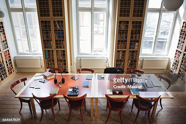 high angle view of empty chairs with table in board room at law library - law library stock pictures, royalty-free photos & images