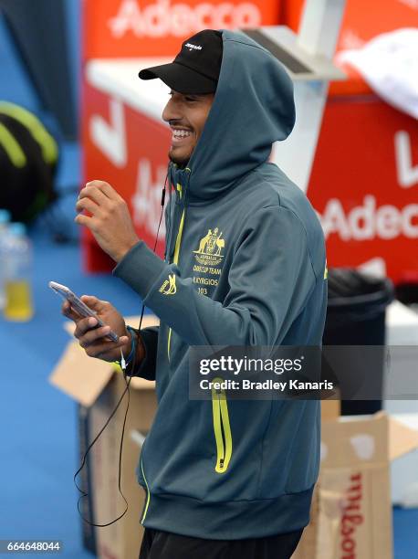 Nick Kyrgios of Australia shares a laugh with team mates during practice ahead of the Davis Cup World Group Quarterfinal match between Australia and...