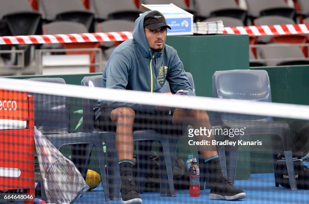 Nick Kyrgios of Australia is seen watching on during practice ahead of the Davis Cup World Group Quarterfinal match between Australia and the USA at...
