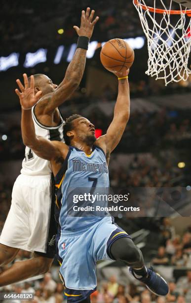 Jonathon Simmons of the San Antonio Spurs prepares to block shot attempt of Wayne Selden of the Memphis Grizzlies at AT&T Center on April 4, 2017 in...
