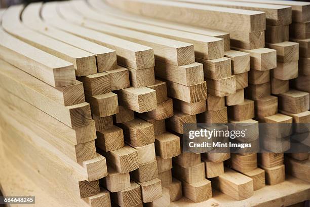 close up of a stack of planed, curved square-edge timber pieces. - planed wood stock pictures, royalty-free photos & images