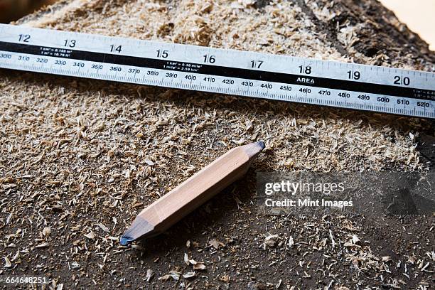 close up of ruler and carpenters pencil sharpened at both ends. - workbench stock pictures, royalty-free photos & images