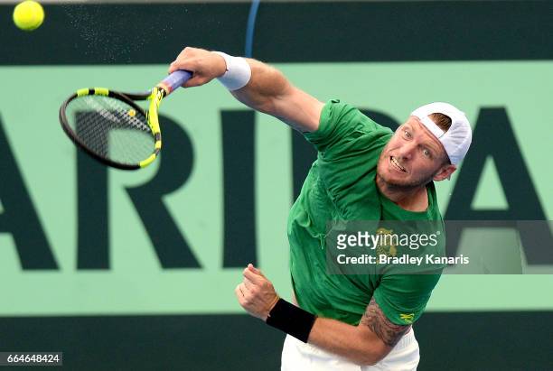 Sam Groth of Australia serves during practice ahead of the Davis Cup World Group Quarterfinal match between Australia and the USA at Pat Rafter Arena...