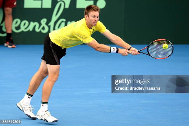 John Peers of Australia stretches out to play a shot during practice ahead of the Davis Cup World Group Quarterfinal match between Australia and the...