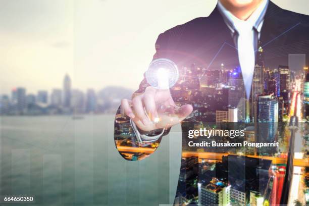 double exposure of businessman press graph on blurred cityscape and financial building background, business trading concept - man double exposure profit concept imagens e fotografias de stock