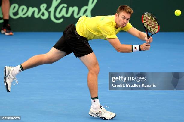 John Peers of Australia stretches out to play a shot during practice ahead of the Davis Cup World Group Quarterfinal match between Australia and the...