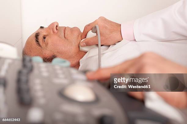 radiologist examining carotid with ultraschall - carotid artery stock pictures, royalty-free photos & images