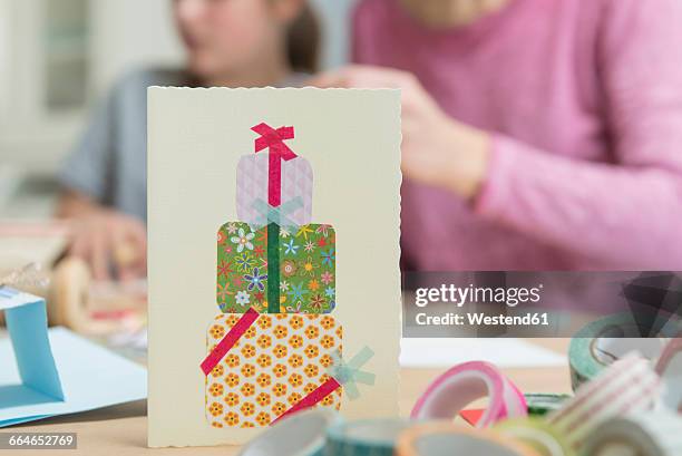 birthday card with people in background - birthday card stock pictures, royalty-free photos & images