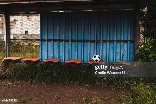 football on empty coaching bench - verlaten slechte staat stockfoto's en -beelden