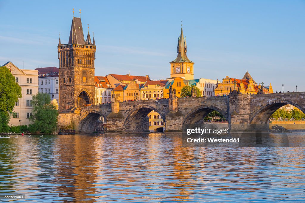 Czechia, Prague, Vltava river, Old town with Charles Bridge with bridge tower, water tower of old mill in the background