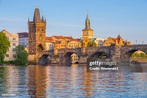 czechia, prague, vltava river, old town with charles bridge with bridge tower, water tower of old mill in the background - prague bildbanksfoton och bilder