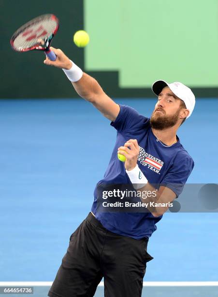 Steve Johnson of the USA plays a shot during practice ahead of the Davis Cup World Group Quarterfinal match between Australia and the USA at Pat...