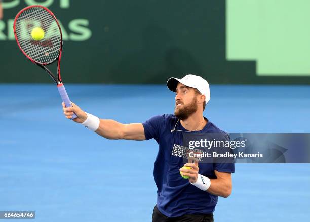 Steve Johnson of the USA plays a shot during practice ahead of the Davis Cup World Group Quarterfinal match between Australia and the USA at Pat...