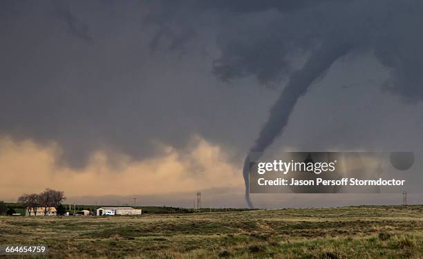 tornado getting stretched from its parent supercell - tornado stockfoto's en -beelden