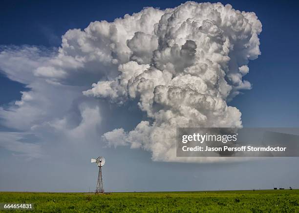 supercell cloud over windmill on fertile plain - wichita stock pictures, royalty-free photos & images