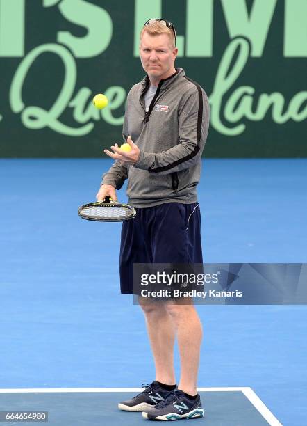 Team Captain Jim Courier of the USA watches on during practice ahead of the Davis Cup World Group Quarterfinal match between Australia and the USA at...