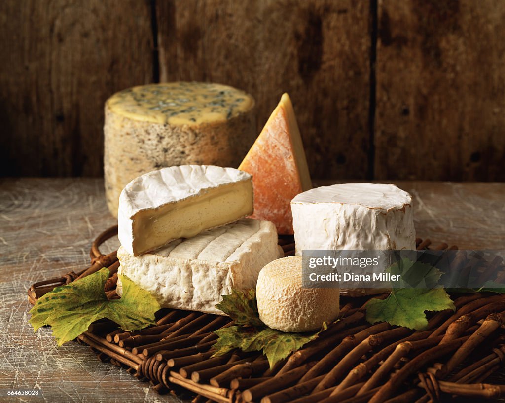 Variety of cheese on wicker tray