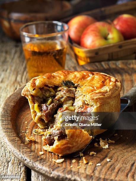 pork, bacon, cider and buttered leek pie - serving dish stock pictures, royalty-free photos & images
