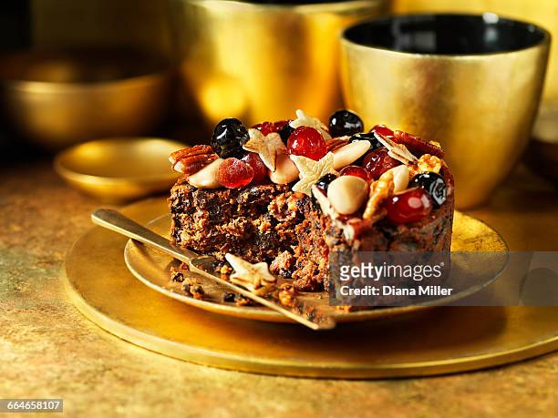 fruit and nuts decorating traditional fruit christmas cake - christmas cake ストックフォトと画像