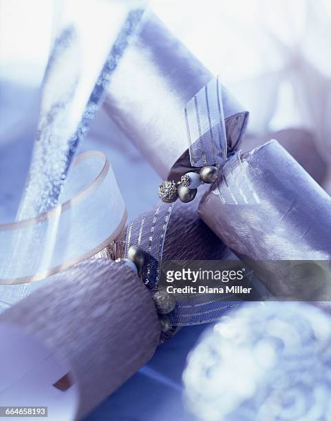 luxury silver christmas crackers, blue tint - christmas crackers stock pictures, royalty-free photos & images