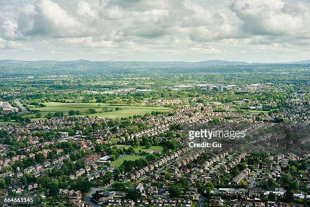 aerial view of suburban housing and distant landscape, england, uk - housing estate stock pictures, royalty-free photos & images