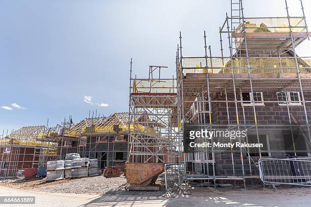 view of housing development on building site - byggnadsställning bildbanksfoton och bilder